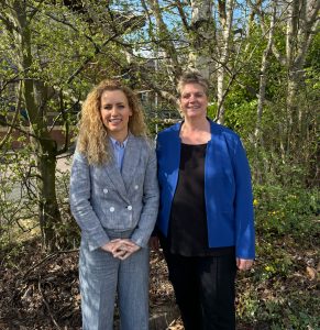 Katie White and Leeds Women's Aid Chief Executive Nik Peasgood stood outside smiling